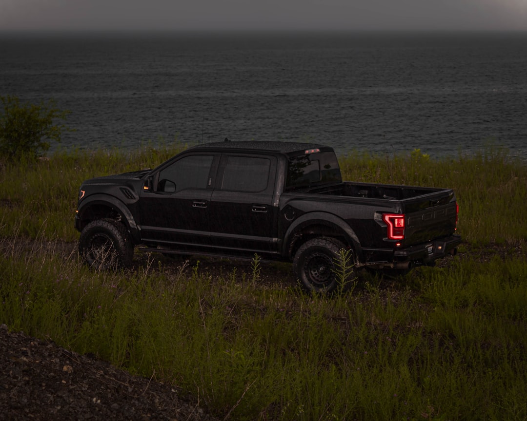 R Edition build — black pickup truck by the coast