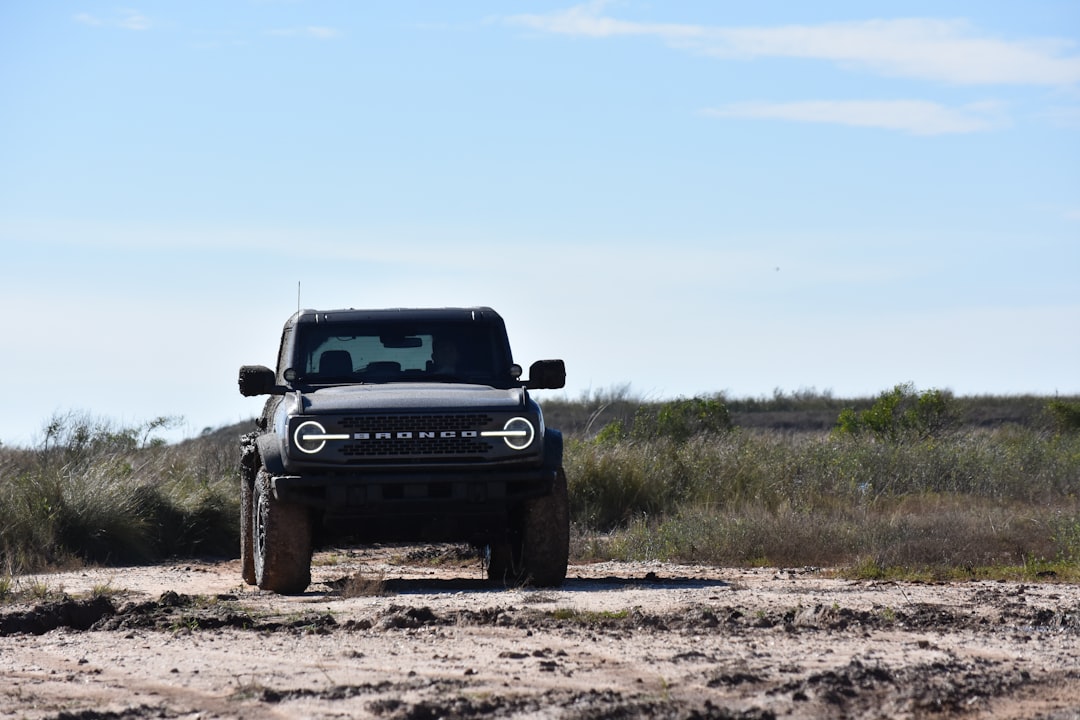 R Sport build — black Ford Ranger on dirt road