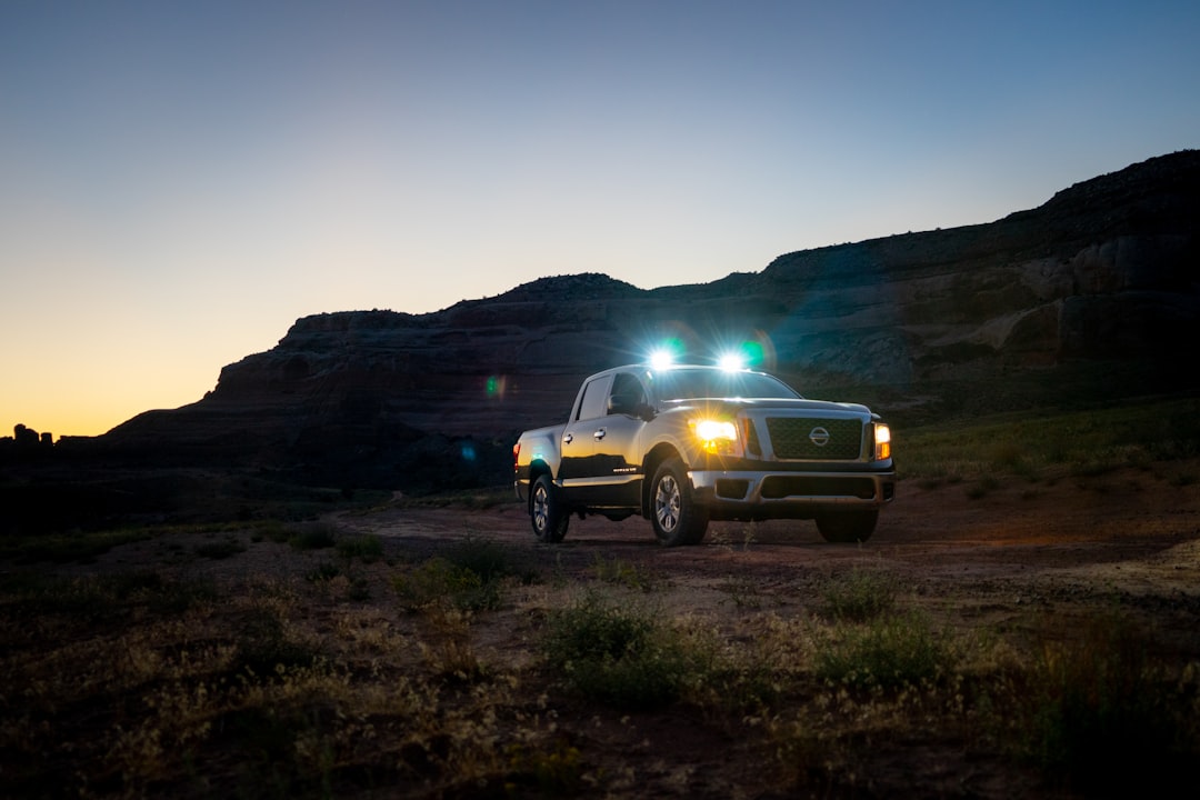 Truck with LED light bar on dirt road